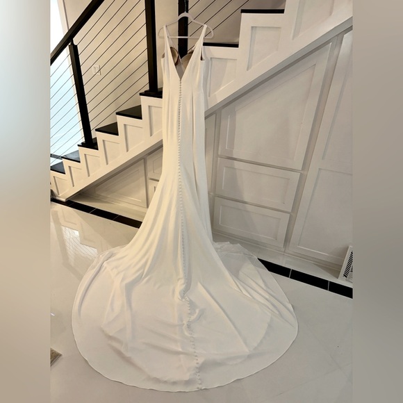 Selling a white wedding dress perfect for an upcoming spring/summer bride!